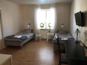 Postel nebo postele na pokoji v ubytování Skärplinge Gästis B&B