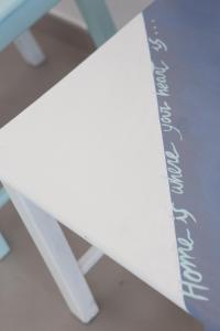 a white surfboard sitting on top of a table at Cocor Suites & Design in Naples