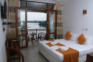 Postel nebo postele na pokoji v ubytování Sanu Lagoon Resort & Spa + 37 fotografií