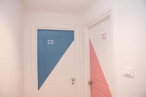 a door with the number on it next to another door at Cocor Suites & Design in Naples