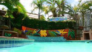 a swimming pool with a painting on the side of it at Ansteys Beach Self Catering Apartments in Durban