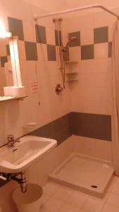 a bathroom with a sink and a toilet and a tub at Casa per ferie Al Centro in Belluno
