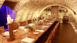 a long dining room with a long table with candles at Hotel Rössle in Fürstenberg