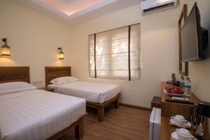 Cama o camas de una habitación en Bagan Vertex Hotel