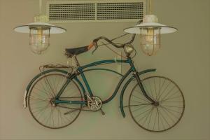 a bike is attached to a wall with lights at Herdade do Ananás in Ponta Delgada