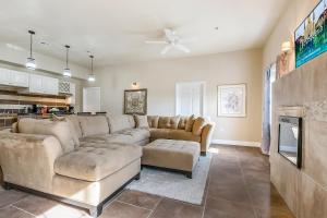 a living room with a couch and a tv at St Charles Ave Urban Retreat with Luxury Amenities in New Orleans