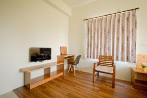 TV a/nebo společenská místnost v ubytování Penghu Sun House