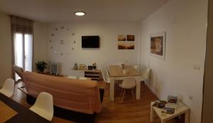 a living room with a couch and a table at Piso Turistico/Vacacional LM in Ronda