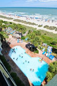 a view of the beach from the balcony of a resort at Sea Crest Oceanfront Resort in Myrtle Beach