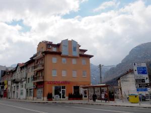a building on the side of a street with a mountain at Hotel Maria in Vratsa