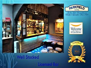 a restaurant with a bar with a well stocked bar at Parkfield Hotel in Blackpool