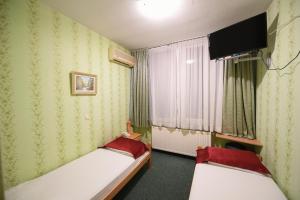 Letto o letti in una camera di Hotel Slodes