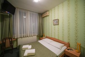 Letto o letti in una camera di Hotel Slodes