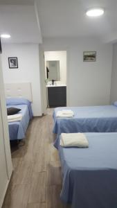 Postel nebo postele na pokoji v ubytování Guesthouse Central