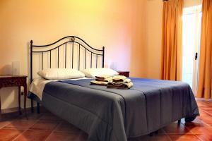 เตียงในห้องที่ Villa Amelie (Mare e Relax)
