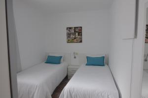 Ein Bett oder Betten in einem Zimmer der Unterkunft Armonía Beach 15