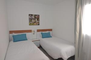 Ein Bett oder Betten in einem Zimmer der Unterkunft Armonía Beach 15