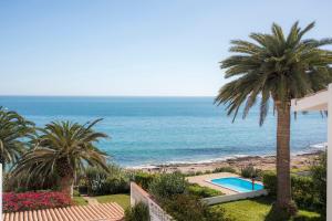 a view of the ocean from the balcony of a house at A29 - Calheta House in Luz in Luz