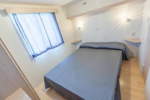Postel nebo postele na pokoji v ubytování Camping Vicenza