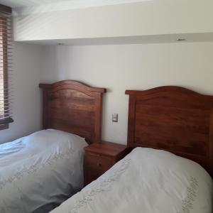 Cama o camas de una habitación en Departamento Lago Vichuquen