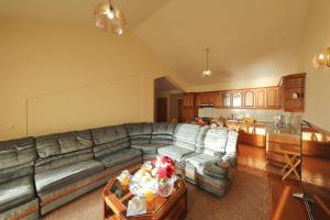 a living room with a couch and a kitchen at Villa Vukic in Vrsi