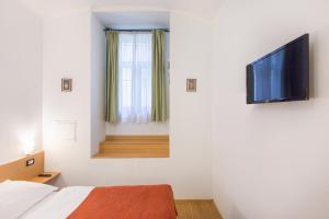 TV a/nebo společenská místnost v ubytování Duskova Apartments