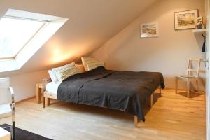 a bedroom with a bed in a attic at Modernes Studio in Richrath in Langenfeld