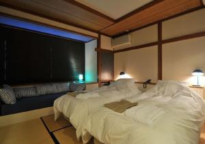 Кровать или кровати в номере Address Nozawa Standard Studio / Vacation STAY 22699