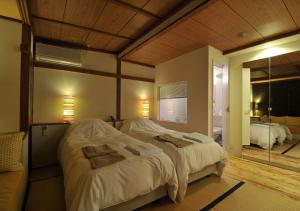 Un pat sau paturi într-o cameră la Address Nozawa Standard Studio / Vacation STAY 22699