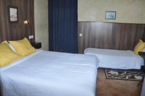 A bed or beds in a room at Gite Nadia