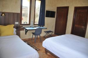 A bed or beds in a room at Gite Nadia