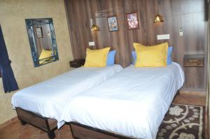 A bed or beds in a room at Gite Nadia