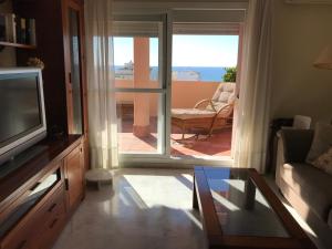 Posedenie v ubytovaní Sub-Àtico con Parking en el Centro de Estepona