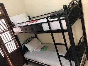 Uma cama ou camas num quarto em TanjaLucia Hostel