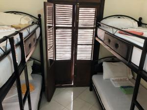 Uma cama ou camas num quarto em TanjaLucia Hostel