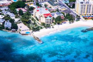 an aerial view of a beach with blue water at White Sands Beach Condos in Christ Church
