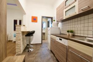 a kitchen with a sink and a counter top at Standard Apartment by Hi5 -Baross Square in Budapest