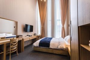 Postel nebo postele na pokoji v ubytování Incheon Aiport Airrelax hotel
