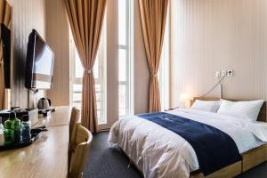 Postel nebo postele na pokoji v ubytování Incheon Aiport Airrelax hotel