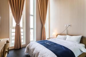Postel nebo postele na pokoji v ubytování Incheon Aiport Airrelax hotel