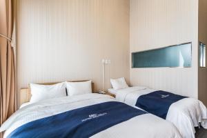 Postel nebo postele na pokoji v ubytování Incheon Aiport Airrelax hotel