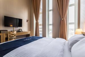 Postel nebo postele na pokoji v ubytování Incheon Aiport Airrelax hotel