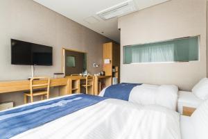 Postel nebo postele na pokoji v ubytování Incheon Aiport Airrelax hotel