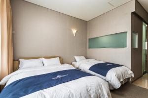 Postel nebo postele na pokoji v ubytování Incheon Aiport Airrelax hotel