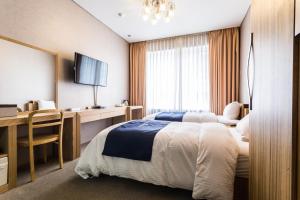 Postel nebo postele na pokoji v ubytování Incheon Aiport Airrelax hotel