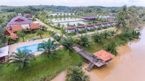 an aerial view of a resort on a river at Lamphurai Riverside Resort and Spa in Trat