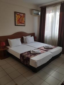 Postel nebo postele na pokoji v ubytování Hotel Tranzzit