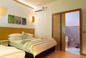 Postel nebo postele na pokoji v ubytování Trip Villa