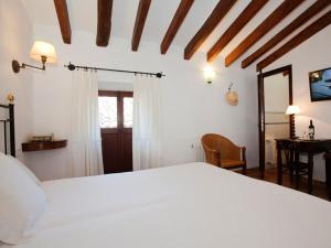 Postel nebo postele na pokoji v ubytování Turismo de Interior S'Ardeviu