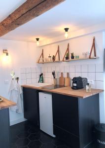 Η κουζίνα ή μικρή κουζίνα στο Place aux huiles